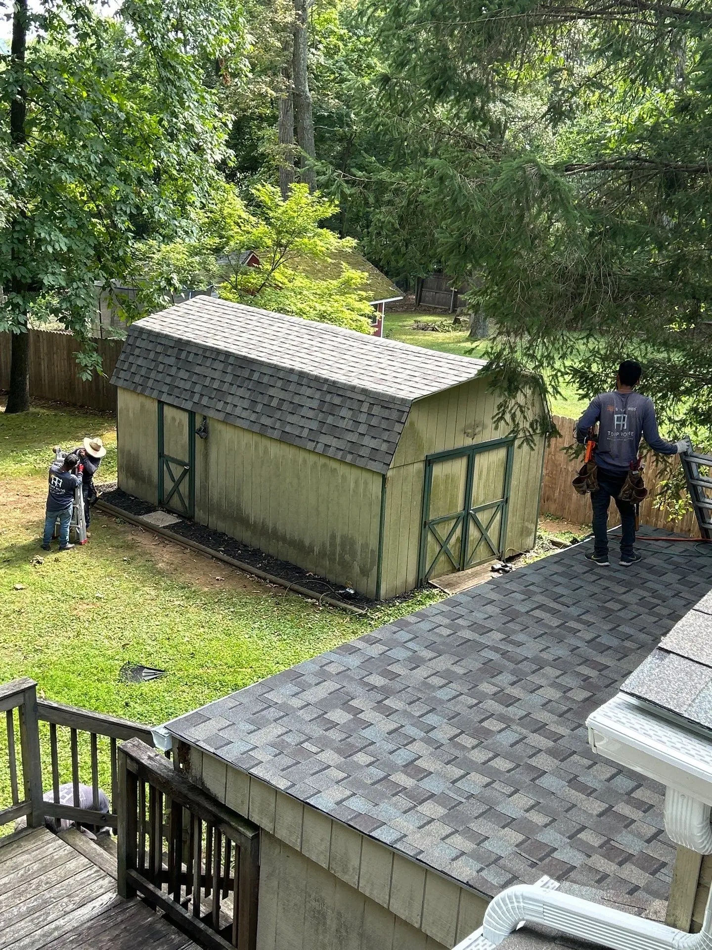 topp home employees performing a roof replacement - My Topp Home